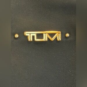 Tumi Black Bag with Gold Accents